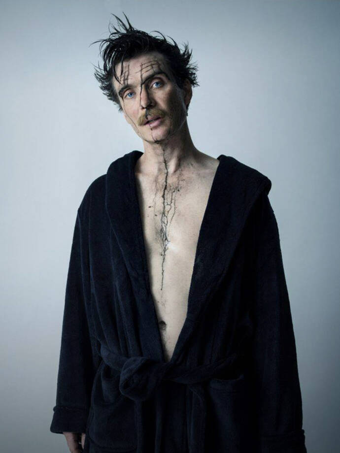 portrait of a man with black blood on his face