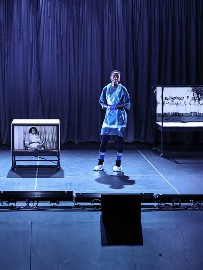 actor in hospital scrubs on a stage