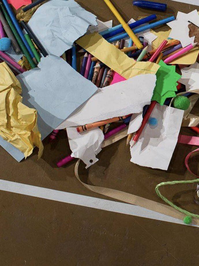 scattered colourful pens and paper