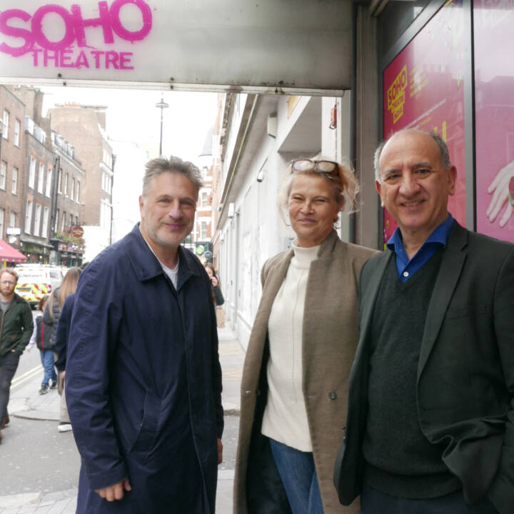 three people outside Soho Theatre